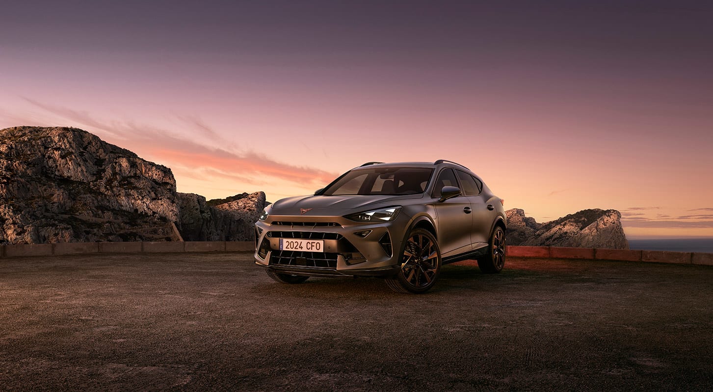 Image showcasing a SEAT S.A. SUV vehicle with a picturesque view of sunset in the background.